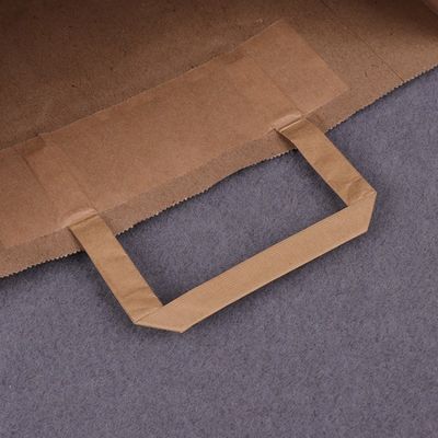 250gsm 300gsmハンドルが付いている生物分解性の使い捨て可能なテーブルウェア ブラウンの紙袋